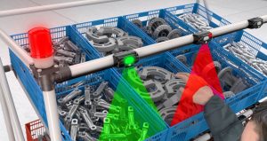 Employee using Pick-to-light system to error proof parts picking process