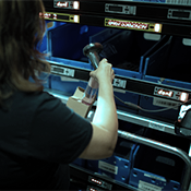 woman using pick-to-light for order fulfillment at 3PL