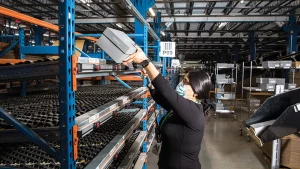 woman using lightning pick put wall for shoe distribution