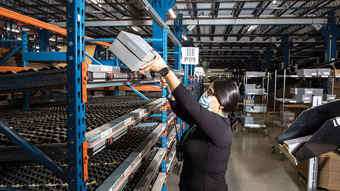 woman using lightning pick put wall for shoe distribution